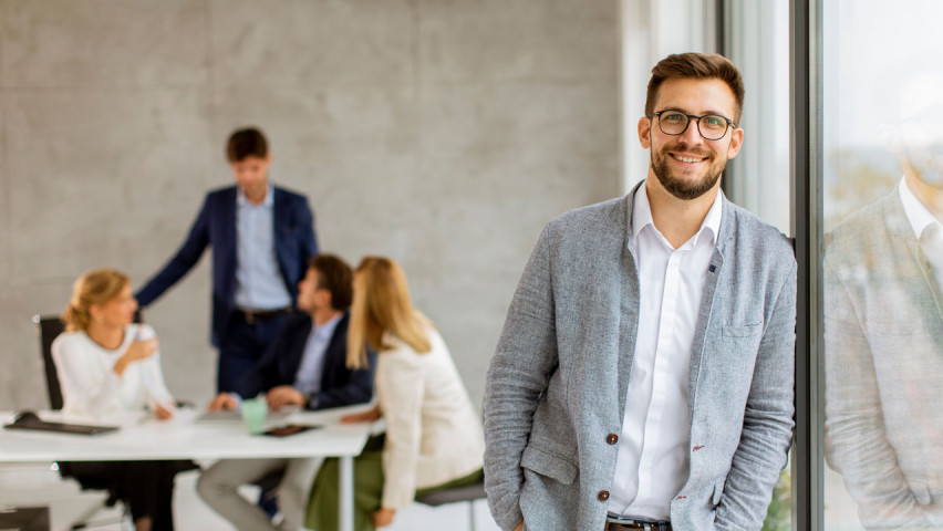 Person in suit, smiling